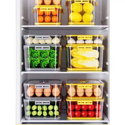 Clear plastic pantry storage containers with colorful fruits and vegetables.