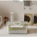 Clear pantry storage container with handle for kitchen organization.