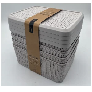 Stacked white plastic storage baskets with lids for home organization.