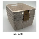 Stacked beige plastic pantry storage baskets for organization.