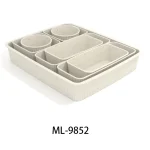 Set of beige pantry storage containers with multiple compartments for organization.